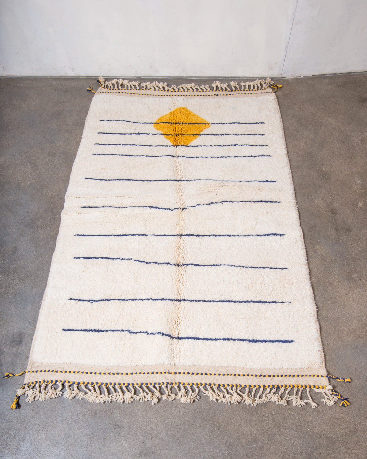 Modern, designer, handcrafted Berber rug from Morocco. Beniourain carpet with beautiful colours and patterns and fluffy wool texture.
